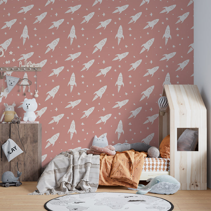 Papier peint chambre enfant à motifs | Fusées blanches sur fond rose délicat