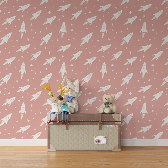 Papier peint chambre enfant à motifs | Fusées blanches sur fond rose délicat