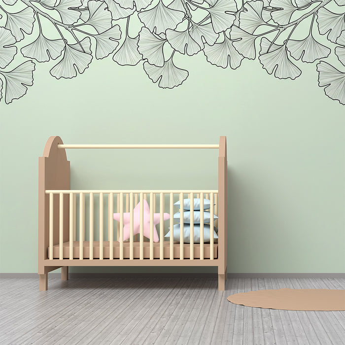 Papel de parede para quarto de bebé | Folhas de ginkgo delicadas sobre fundo verde pastel