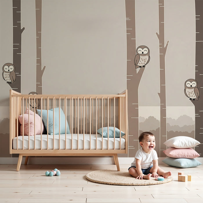 Nursery room wallpaper | Smiling owls perched on soft trees