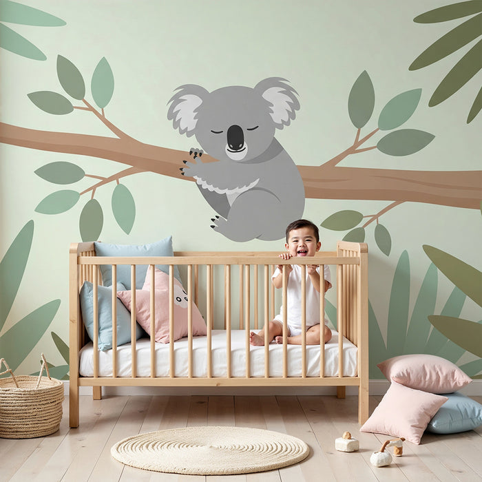 Nursery room wallpaper | Sleeping koala on a branch in the midst of soft foliage