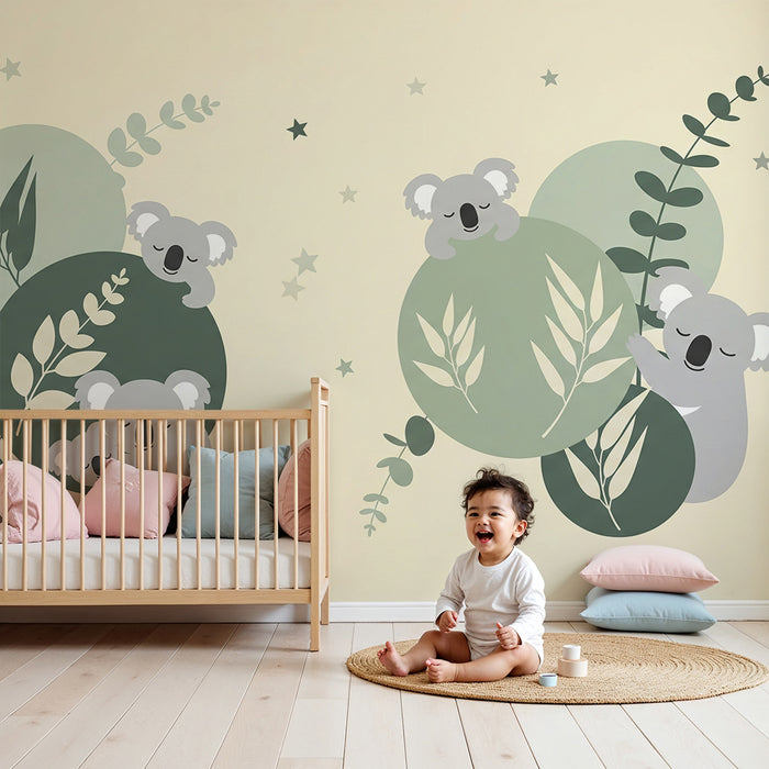 Papier peint chambre bébé | Koalas endormis sur des cercles doux et feuillage apaisant
