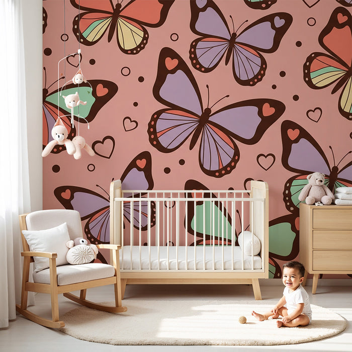 Behang voor babykamer | Kleurrijke vlinders op roze achtergrond met hartjes
