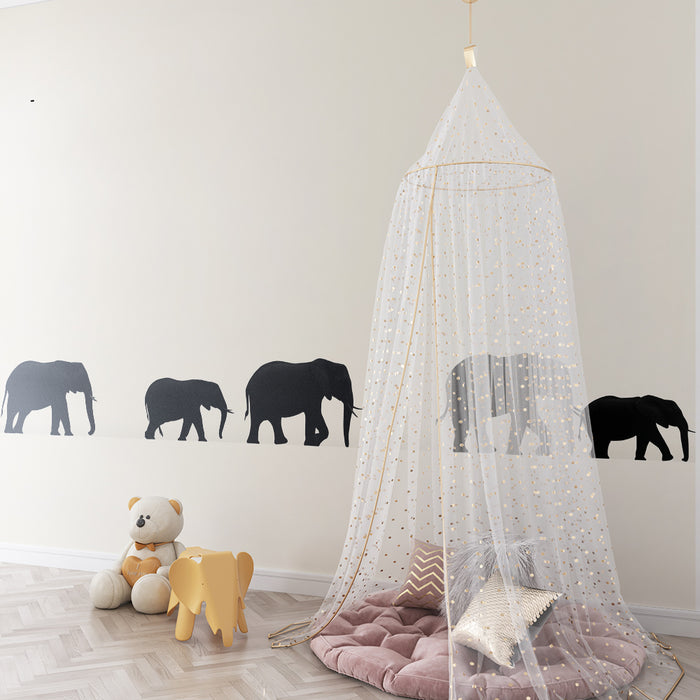 Papel de parede quarto bebê | Silhuetas de elefantes caminhando em um fundo suave