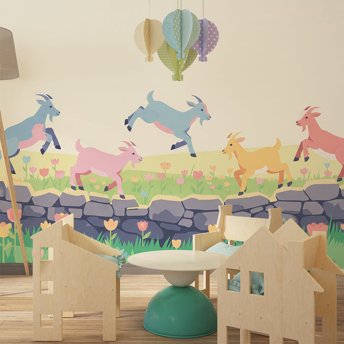 Kinderzimmer Tapete | Bunte Ziegen springen über eine blumige Mauer.